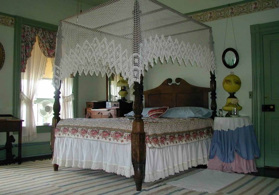 bed and breakfast bedroom with green walls